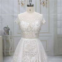 Illusion Luxury Lace Beading Wedding Dress A-Line Robe de mariée à manches courtes avec train court Taille naturelle Longueur au sol avec ceinture