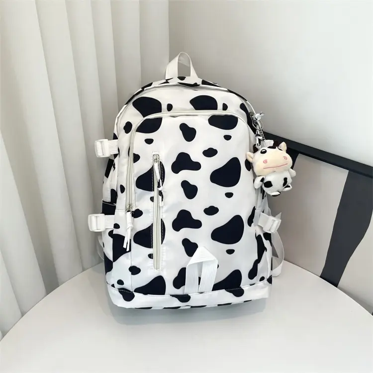 उच्च गुणवत्ता वाली पश्चिमी शैली बड़ी क्षमता वाली गाय प्रिंट स्कूलबैग कैनवास पशु प्रिंट बुक बैग सफेद दूध बैकपैक