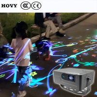 Projecteur de sol interactif créatif pour l'extérieur avec design portable et léger et haut-parleur intégré pour une expérience magique