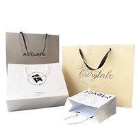 Échantillon gratuit de sacs shopping en papier recyclé avec logo personnalisé pour l'emballage de vêtements et de chaussures, sac en papier sur mesure