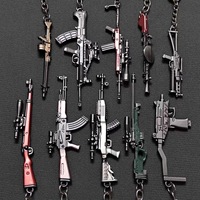 Vente en gros de 49 styles de mini-pistolets en alliage, porte-clés, modèles de pistolets de jeu, pendentifs, jouets cool pour garçons, accessoires pour sacs à dos, cadeaux d'anniversaire sûrs pour garçons