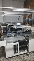 Machine d'emballage entièrement automatique d'occasion, idéale pour la production de jeans et de vêtements d'intérieur, permettant de réduire les coûts de main-d'œuvre et d'augmenter l'efficacité.