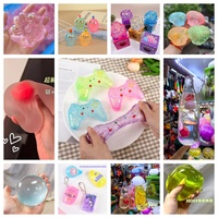 Boîte mystère – Nouveauté très prisée : Manette de jeu scintillante, jouet souple à presser (12 pièces/boîte) – Cadeaux de fête, jouets anti-stress et anti-anxiété