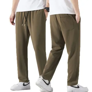 Celana olahraga pria, warna Solid kasual longgar kaki lurus celana saku celana olahraga Jogging pakaian kebugaran Gym