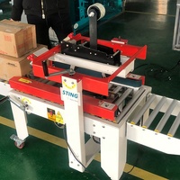 Machine à banderoleuse adhésive semi-automatique électrique Sting pour la fermeture de boîtes en plastique et cartons