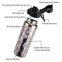 Bouteille d'eau sport isolée en acier inoxydable et titane massif de 600 ml avec couvercle à paille à bouton-poussoir