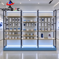Support d'affichage de téléphone portable en acier inoxydable brossé OEM avec trou pour câble, idéal pour les centres commerciaux