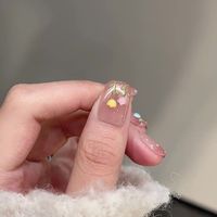Faux ongles faits main à presser en plastique ABS, style français nude avec strass, forme amande, motif cœur, ensemble complet pour doigts