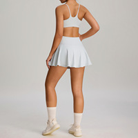 Ensemble de jupe de tennis pour femmes en stock du fabricant, vêtements de sport de badminton en plein air, ensemble deux pièces avec poches pour la protection de la modestie