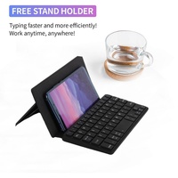 Clavier de téléphone sans fil pliable Clavier sans fil portable avec support de support Clavier ultra fin rechargeable pour smartphone