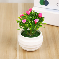 Vente en gros pour fabricants : Pot de fleurs artificielles créatif avec petites roses solides 'Sept étoiles' et plantes vertes, pour la remise des diplômes et la fête des Mères