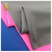 Langka 100 polyester tricot solide oeillet respirant oeil d'oiseau maille tissu de sport pour t-shirt vente en gros