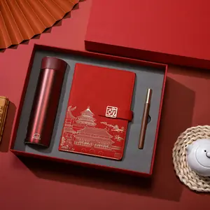 Venta al por mayor logotipo personalizado estilo chino bajar a un comienzo volador de cuero rojo A5 cuaderno botella de agua caja de papelería