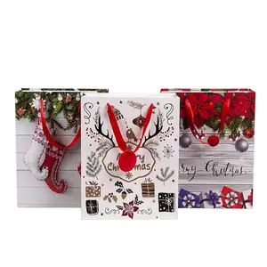 Bolsa de papel con asa de Navidad, embalaje de ropa de regalo con impresión colorida de tamaño personalizado