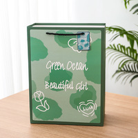 Sac cadeau floral vert avec poignées en cordon noir, sac de shopping en papier imprimé pour les petites commandes de produits et les cadeaux saisonniers