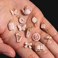 Ciondolo Vintage in Stile Femminile con Fiocco, Libro e Farfalla in Acciaio Inox Placcato Oro con Pizzo Rosa Francese, Accessori per Gioielli Fai-da-Te