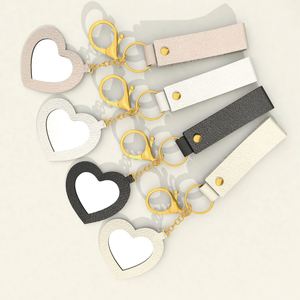 Low MOQ Cute and Creative Small PU <b>Leather</b> Heart-shaped Mirror <b>Keychain</b> with Many Colors for Bag Pendant in Stock - Product Image 2
