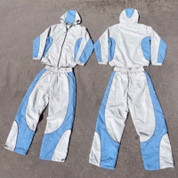 Ensemble de survêtement personnalisé pour homme, coupe-vent color block avec capuche zippée et pantalon en nylon, style streetwear, marque privée, faible MOQ, OEM ODM, directement de l'usine