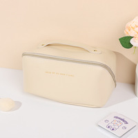 Sac Tendance 2024 PU Cuir Oreiller Sac Grande Capacité Cosmétique Sac Portable Voyage Articles De Toilette Haute Valeur Sac De Rangement