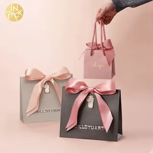 En paquete personalizado impreso joyería de lujo boda zapatos cosméticos ropa embalaje papel regalo bolsas de compras con su propio logotipo