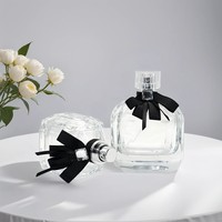 Design de luxe forme plate Unique 30ml/50ml/100ml flacons de parfum/huile en verre couvercle transparent nœud papillon noir vide parfum bouchon à vis