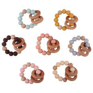 Vente en gros <span class=keywords><strong>Anneau</strong></span> <span class=keywords><strong>de</strong></span> <span class=keywords><strong>dentition</strong></span> pour bébé en silicone <span class=keywords><strong>de</strong></span> qualité alimentaire sans BPA Jouets sensoriels <span class=keywords><strong>Anneau</strong></span> en bois Perles <span class=keywords><strong>de</strong></span> silicone Jouet <span class=keywords><strong>de</strong></span> <span class=keywords><strong>dentition</strong></span> rond pour bébé - Product Image 1