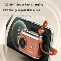 Batterie externe de style rétro en forme d'appareil photo, capacité de 10 000 mAh, prend en charge la charge rapide 22,5 W, avec câble intégré, fonctionnalités de flash sécurisé