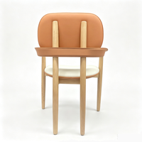 Fauteuil de salle à manger en bois massif pour hôtel avec assise en cuir et dossier ovale