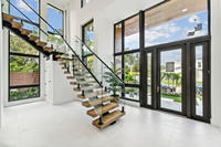 Escalier en colimaçon intérieur en acier inoxydable sur mesure YL METAL avec marches en bois et garde-corps en verre