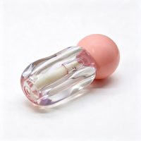 Tube de gloss transparent à effet d'ondulation irrégulière, avec bouchon sphérique, emballage vide pour gloss