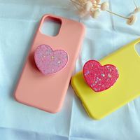 Vente chaude support universel de poignée de doigt de téléphone nouveaux accessoires en forme de coeur de puissance de paillettes en matériau PC Durable