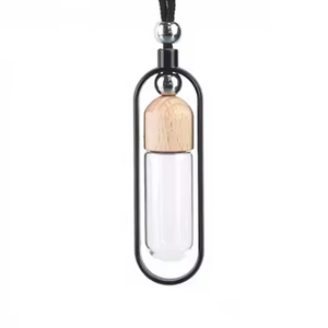 Diffuseur d'aromathérapie pour voiture en forme de cylindre, flacon de parfum avec bouchon en bois et cadre métallique - Product Image 1