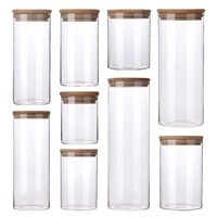 Vente en gros sur mesure Bocaux en verre borosilicaté pour le stockage des aliments Boîtes en verre Récipient en bambou Bocaux en verre avec couvercle en bambou