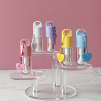 Tube de brillant à lèvres rose en plastique Transparent de 5ml avec grand pinceau forme ronde chaîne d'amour accessoire tube de rouge à lèvres brillant à lèvres