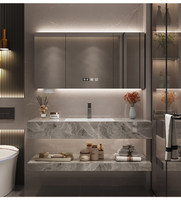 Ensemble de meubles de salle de bain de style hôtel moderne avec comptoir en pierre frittée résistant à l'eau et lavabo en céramique intégré sans joint