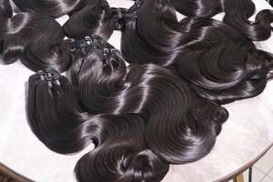 Paquete de cabello crudo color natural de onda corporal (1B) calidad premium fabricante de Vietnam estilo recto procesado químico ligero - Product Image 6