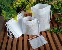Sachets de thé jetables non tissés avec cordon de serrage, sachets filtrants vides pour feuilles de thé, herbes et épices, logo personnalisé OEM