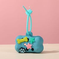 Support décoratif tendance pour sacs à déjections canines en silicone en forme d'os, distributeur de sacs à déjections pour animaux de compagnie avec conception de sac à déchirure facile, pour produits pour animaux transfrontaliers