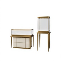 Luxuriöse Einkaufsvitrine Hochwertige Elegante Goldene Edelstahl-Schmuckvitrine LED-Beleuchtete Gehärtete Glas-Theke Langlebig