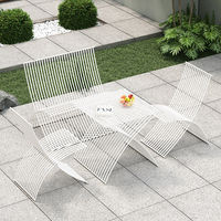 Table et chaise pliantes d'extérieur en fer forgé, style nordique moderne et minimaliste, pour cour communautaire, café, balcon, ambiance décontractée en plein air