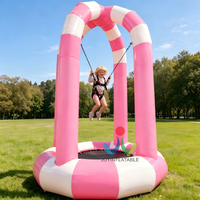Trampoline gonflable rose robuste pour usage commercial avec cordes élastiques et poteaux rayés pour événements d'enfants