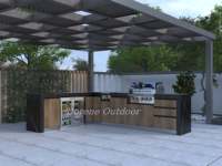 Ensemble de cuisine extérieure de luxe avec îlot barbecue, pièce maîtresse pour la cuisson, doté de sièges de bar et de niches de présentation pour l'amusement en cour