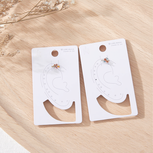 Orecchini a clip a cinque fiori con strass, confezione singola - Product Image 3