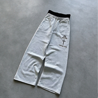 Pantalon de survêtement pour homme en coton épais 100% gris chiné avec contraste noir, coupe droite, imprimé lettres verticales, taille élastique, coupe ample