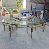 Table de mariage de luxe ronde en acier inoxydable doré avec plateau en verre miroir pour la décoration de la table de mariage