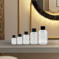 Flacon diffuseur en verre transparent de luxe personnalisé avec bouchon à vis noir imprimé à l'écran pour huiles essentielles