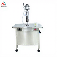 Machine de remplissage et de sertissage semi-automatique pneumatique linéaire avancée pour applications cosmétiques et chimiques