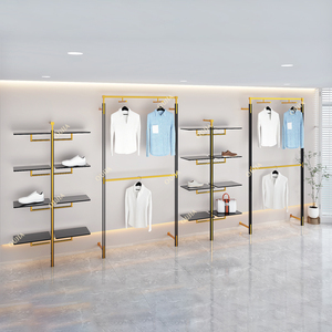 Étagère de <span class=keywords><strong>magasin</strong></span> de vêtements en métal doré brillant personnalisée, support à sacs en acier inoxydable, présentoir mural pour chaussures, présentoir pour chaussures et sacs - Product Image 2