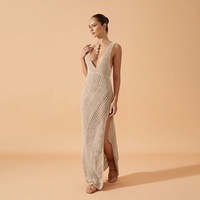 Robe de plage de style européen et américain pour femmes Couleur pure Sexy col en V fendu Robe longue de plage tricotée pour femme