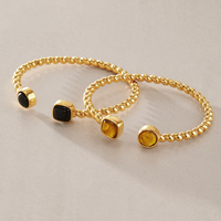 Bracelet manchette torsadé J&D Designer Vintage en acier inoxydable plaqué or 18 carats PVD avec ambre en résine naturelle